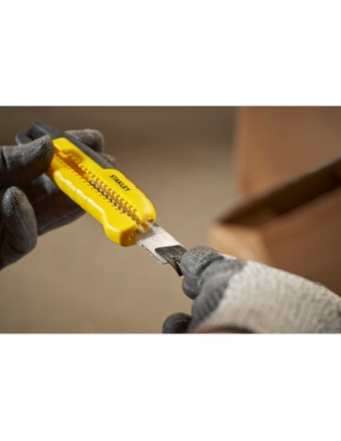 Cúter bi-material segmentación lateral con deslizador estándar 18 mm