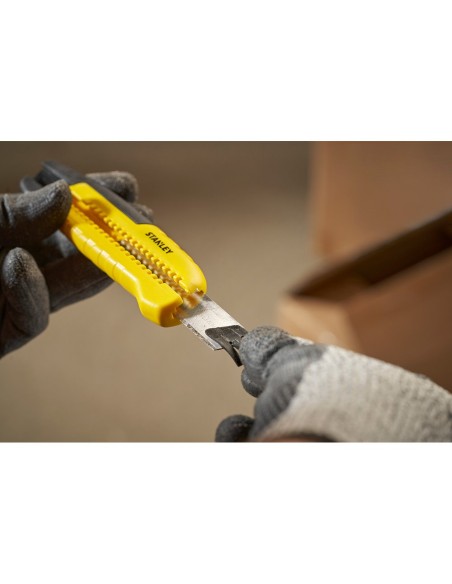 Cúter bi-material segmentación lateral con deslizador estándar 18 mm