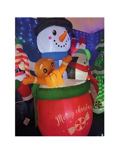 Inflatable snowman in a mug with a penguin and a gingerbread man